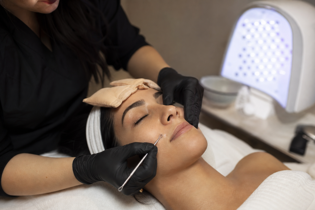 Close-up of a professional extraction being performed with sterile technique.